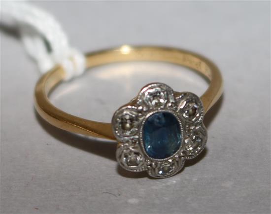 A 1920s 18ct gold and platinum, sapphire and diamond cluster ring, size N.